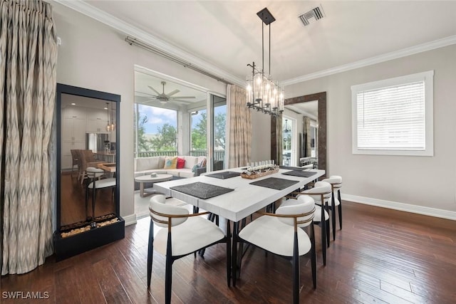 646 Vintage Reserve Cir Unit 4D, Naples, FL 34119 - dining space with crown molding, baseboards, dark wood finished floors, and a chandelier