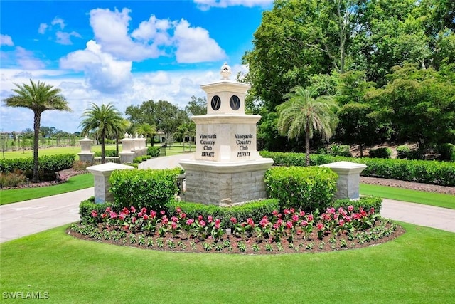 646 Vintage Reserve Cir Unit 4D, Naples, FL 34119 - community / neighborhood sign with a lawn