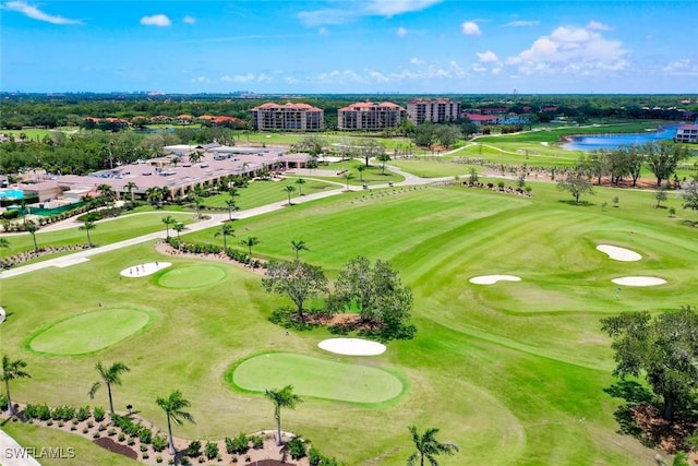 646 Vintage Reserve Cir Unit 4D, Naples, FL 34119 - drone / aerial view of a nearby body of water, a local golf course, and apartment complex / building