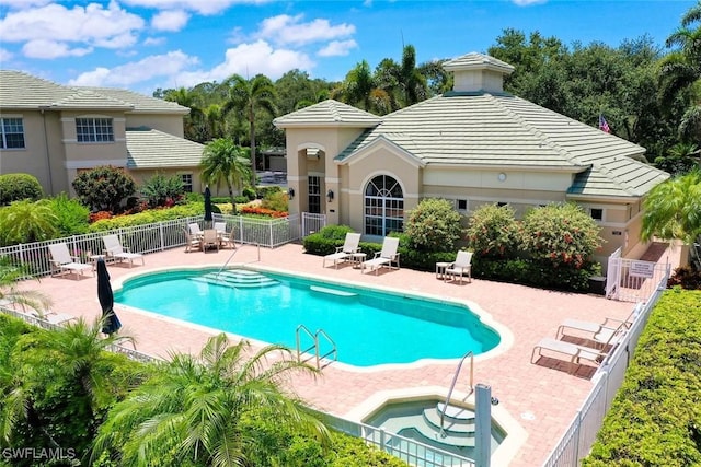 646 Vintage Reserve Cir Unit 4D, Naples, FL 34119 - community pool featuring a patio area