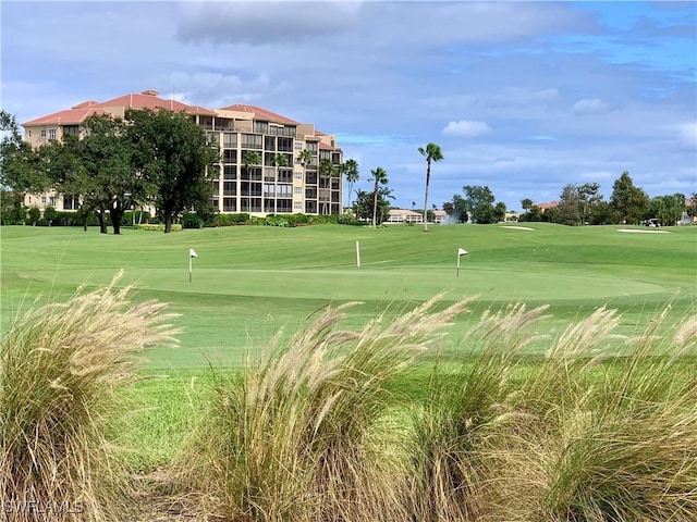 646 Vintage Reserve Cir Unit 4D, Naples, FL 34119 - view of property's community featuring golf course view, an area to practice putting, and a yard