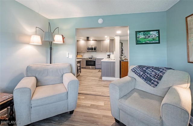 5741 Whitaker Rd Unit D103, Naples, FL 34112 - living room with light wood-style flooring