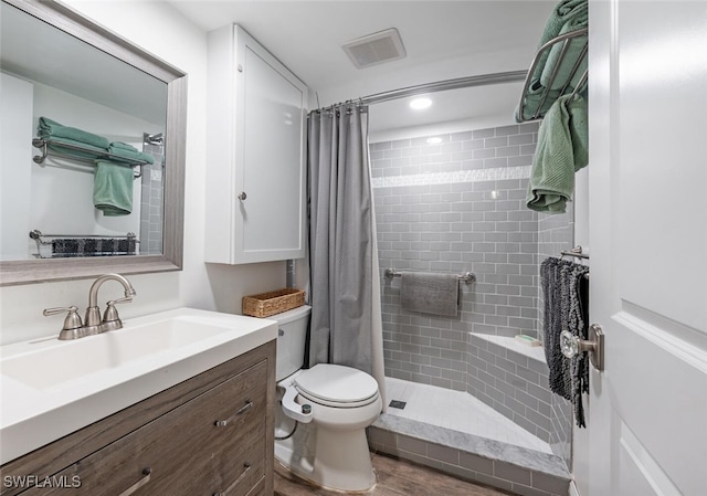 5741 Whitaker Rd Unit D103, Naples, FL 34112 - full bathroom featuring toilet, tiled shower, and vanity