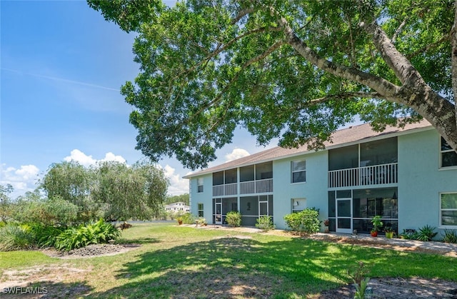 5741 Whitaker Rd Unit D103, Naples, FL 34112 - view of green lawn featuring a sunroom