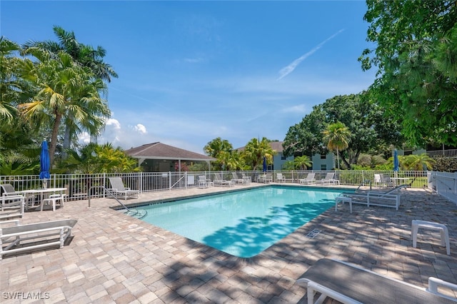 5741 Whitaker Rd Unit D103, Naples, FL 34112 - community pool featuring a patio area