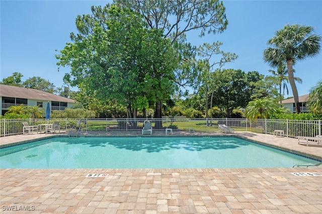5741 Whitaker Rd Unit D103, Naples, FL 34112 - community pool featuring a patio