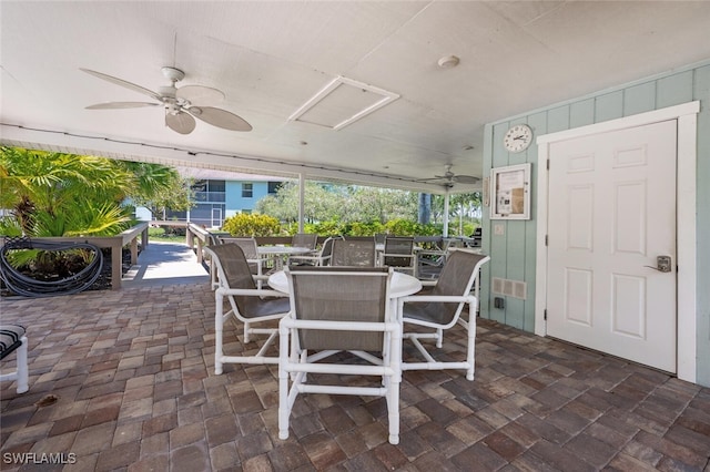 5741 Whitaker Rd Unit D103, Naples, FL 34112 - view of patio with a ceiling fan and outdoor dining area