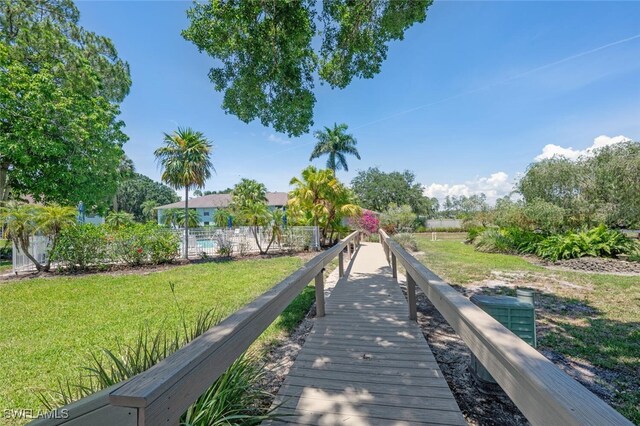 5741 Whitaker Rd Unit D103, Naples, FL 34112 - view of property's community featuring a yard