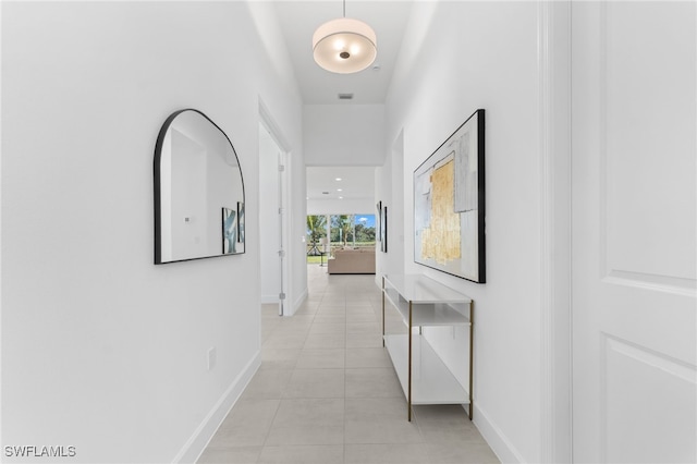 12467 Purple Ficus Way, Naples, FL 34120 - hallway with light tile patterned flooring and baseboards