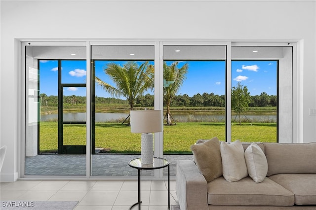 12467 Purple Ficus Way, Naples, FL 34120 - doorway to outside with a water view and tile patterned floors