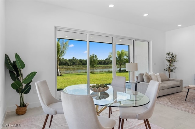 12467 Purple Ficus Way, Naples, FL 34120 - dining room featuring a water view, recessed lighting, and light tile patterned floors