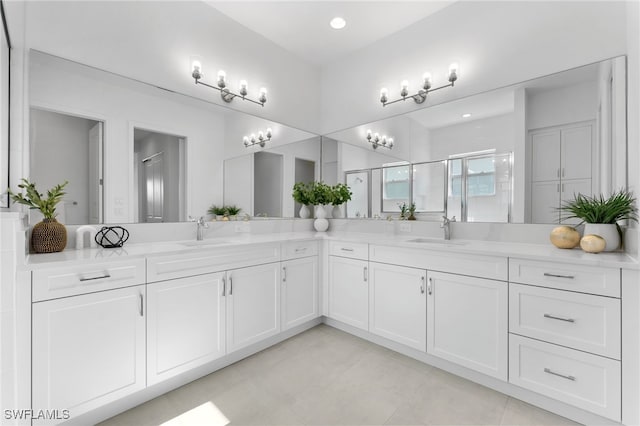 12467 Purple Ficus Way, Naples, FL 34120 - full bathroom with double vanity, a stall shower, and tile patterned flooring