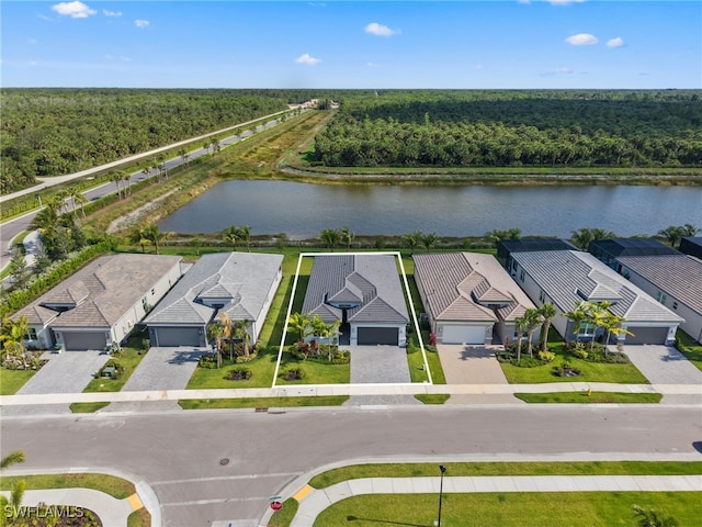 12467 Purple Ficus Way, Naples, FL 34120 - aerial view of residential area with a heavily wooded area and a large body of water