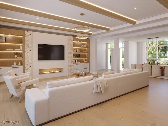 707 Buttonbush Ln, Naples, FL 34108 - living area featuring built in features, beamed ceiling, a glass covered fireplace, and wood finished floors