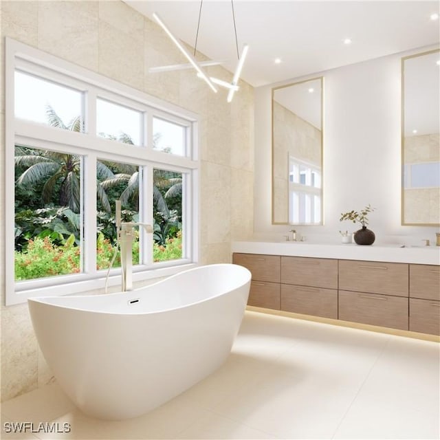707 Buttonbush Ln, Naples, FL 34108 - bathroom featuring double vanity and a freestanding tub