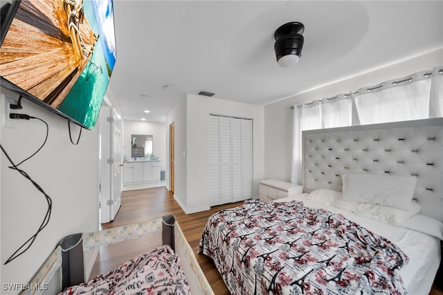 14260 Mcgregor Blvd, Fort Myers, FL 33919 - bedroom with wood finished floors, ensuite bath, baseboards, and a closet