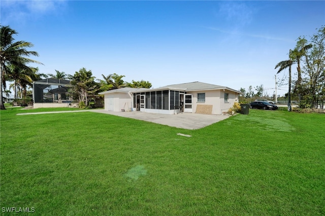 14260 Mcgregor Blvd, Fort Myers, FL 33919 - rear view of house featuring a sunroom and a lawn