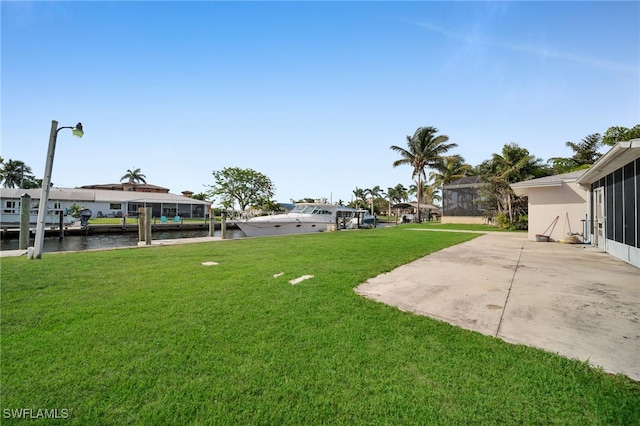 14260 Mcgregor Blvd, Fort Myers, FL 33919 - view of green lawn featuring a patio area and a water view