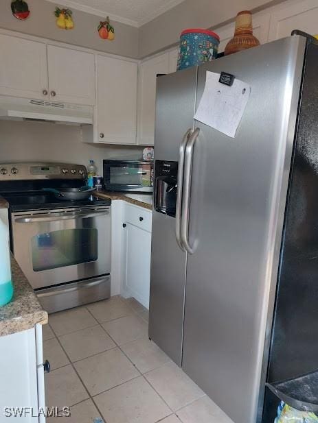 11421 Kimble Dr Unit 423, Fort Myers, FL 33908 - kitchen featuring stainless steel appliances, under cabinet range hood, white cabinets, light tile patterned floors, and ornamental molding