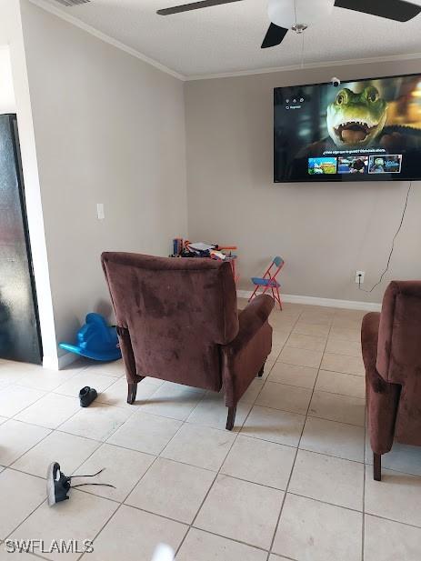 11421 Kimble Dr Unit 423, Fort Myers, FL 33908 - living area featuring ceiling fan, crown molding, light tile patterned floors, and baseboards
