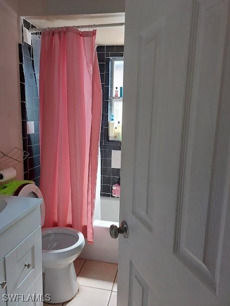 11421 Kimble Dr Unit 423, Fort Myers, FL 33908 - bathroom with tile patterned floors, vanity, toilet, and shower / bath combo with shower curtain