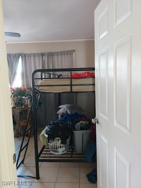 11421 Kimble Dr Unit 423, Fort Myers, FL 33908 - tiled bedroom with crown molding