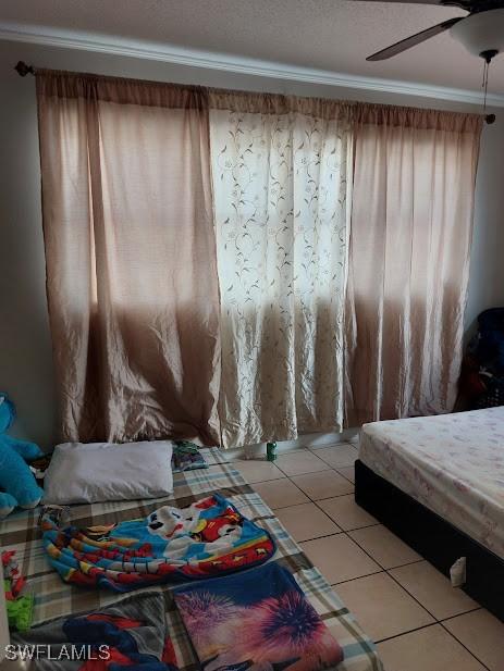 11421 Kimble Dr Unit 423, Fort Myers, FL 33908 - bedroom featuring light tile patterned flooring and ceiling fan
