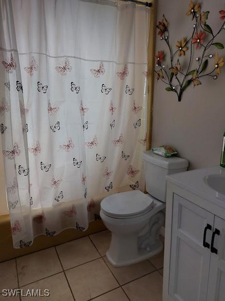 11421 Kimble Dr Unit 423, Fort Myers, FL 33908 - bathroom with tile patterned floors, toilet, vanity, and shower / tub combo
