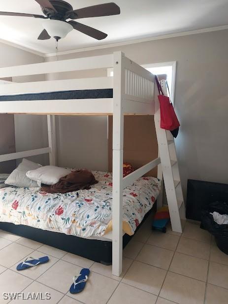 11421 Kimble Dr Unit 423, Fort Myers, FL 33908 - tiled bedroom featuring crown molding and a ceiling fan