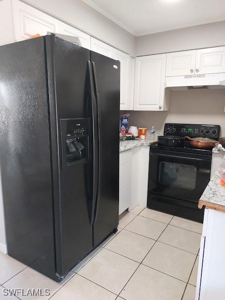 11421 Kimble Dr Unit 423, Fort Myers, FL 33908 - kitchen featuring black fridge, range, under cabinet range hood, light countertops, and white cabinets