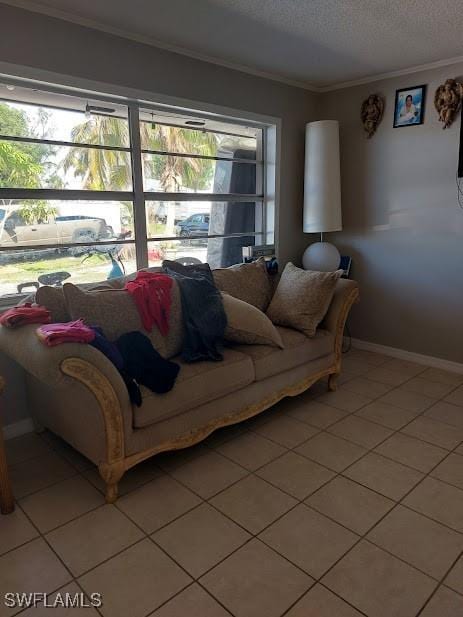 11421 Kimble Dr Unit 423, Fort Myers, FL 33908 - living room featuring crown molding, light tile patterned floors, baseboards, and a textured ceiling