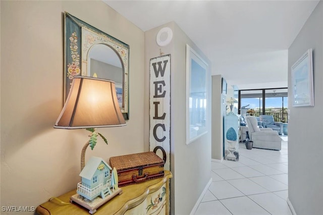 10562 Gulf Shore Dr Unit 402, Naples, FL 34108 - hall with baseboards and light tile patterned floors