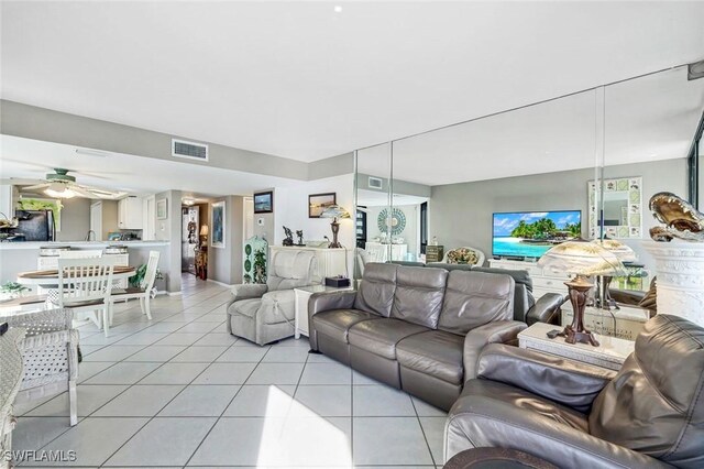 10562 Gulf Shore Dr Unit 402, Naples, FL 34108 - living area with light tile patterned flooring and ceiling fan