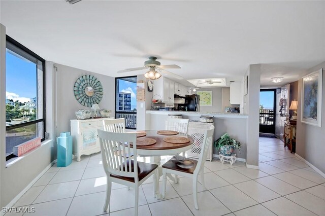 10562 Gulf Shore Dr Unit 402, Naples, FL 34108 - dining room featuring ceiling fan, baseboards, and light tile patterned floors