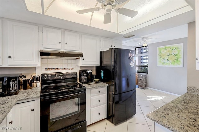 10562 Gulf Shore Dr Unit 402, Naples, FL 34108 - kitchen with black appliances, under cabinet range hood, ceiling fan, light tile patterned floors, and white cabinetry
