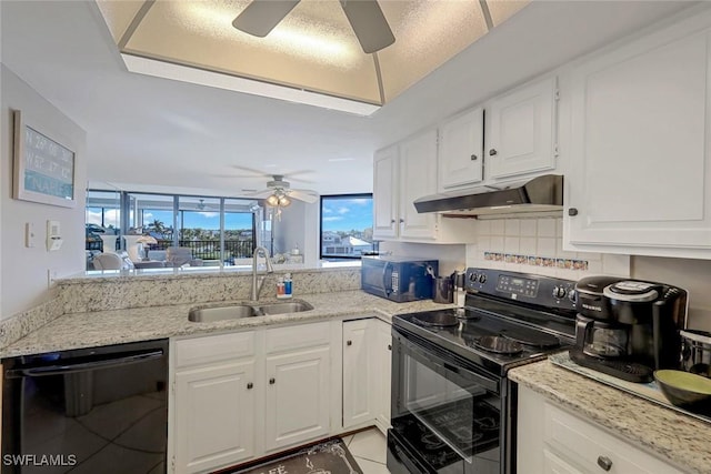10562 Gulf Shore Dr Unit 402, Naples, FL 34108 - kitchen featuring black appliances, a sink, a ceiling fan, under cabinet range hood, and white cabinets