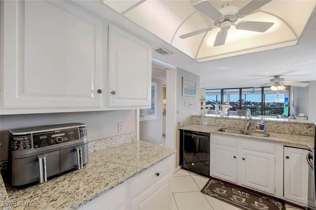 10562 Gulf Shore Dr Unit 402, Naples, FL 34108 - kitchen featuring black dishwasher, a sink, ceiling fan, white cabinets, and light tile patterned floors