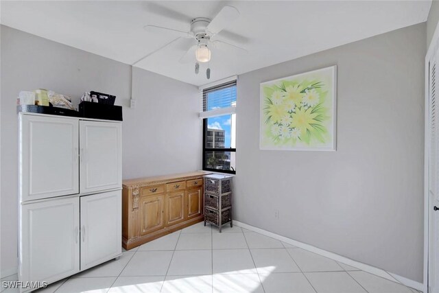 10562 Gulf Shore Dr Unit 402, Naples, FL 34108 - dining area with ceiling fan, baseboards, and light tile patterned floors