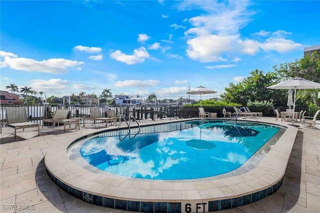 10562 Gulf Shore Dr Unit 402, Naples, FL 34108 - community pool with a patio area
