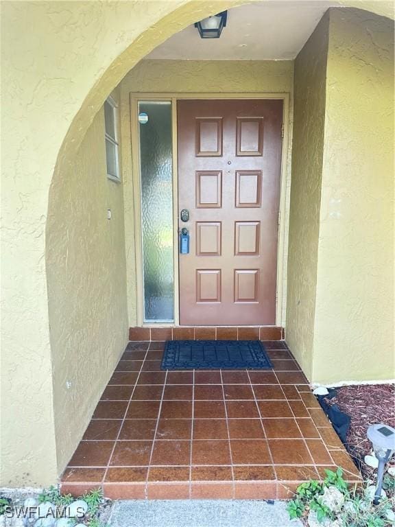 901 SE 27th Ter, Cape Coral, FL 33904 - view of exterior entry featuring stucco siding