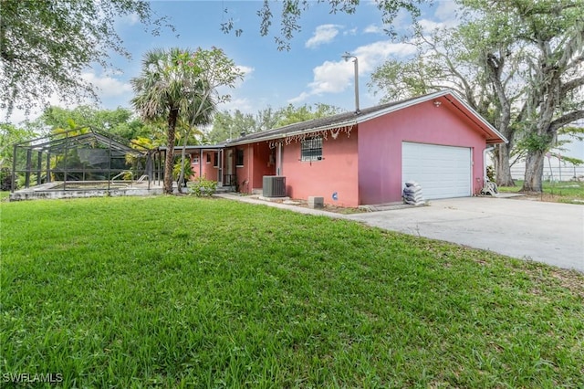 1400 Billie St, Fort Myers, FL 33916 - view of front facade featuring stucco siding, central AC unit, a front yard, a garage, and driveway