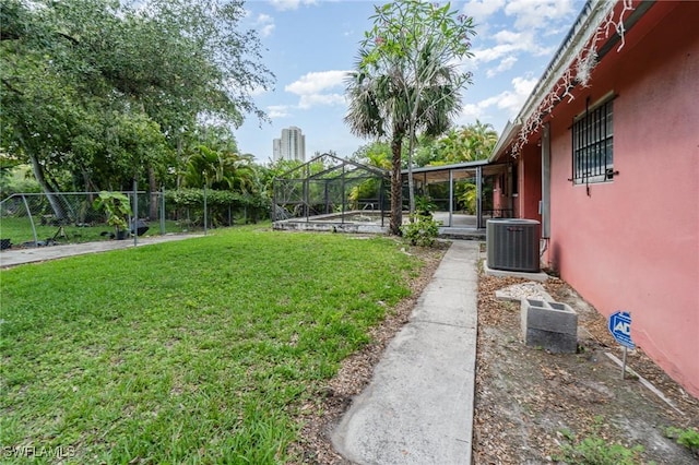 1400 Billie St, Fort Myers, FL 33916 - view of yard with central air condition unit and glass enclosure