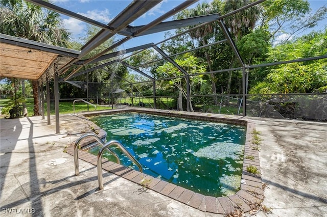1400 Billie St, Fort Myers, FL 33916 - swimming pool featuring glass enclosure and a patio
