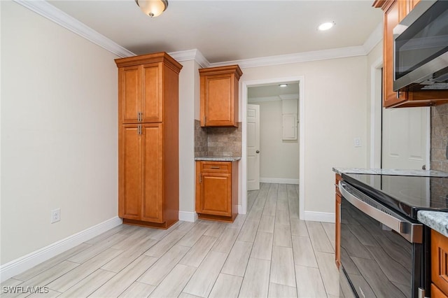 1400 Billie St, Fort Myers, FL 33916 - kitchen with stainless steel appliances, decorative backsplash, brown cabinetry, light stone counters, and baseboards