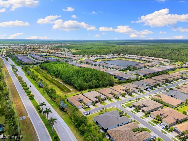 28648 Lobos Cir, Bonita Springs, FL 34135 - view of property location with nearby suburban area, a large body of water, and a forest