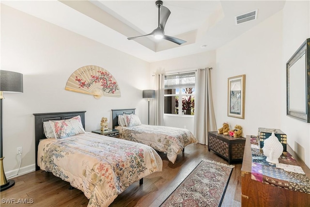 28648 Lobos Cir, Bonita Springs, FL 34135 - bedroom featuring wood finished floors, ceiling fan, baseboards, and a raised ceiling