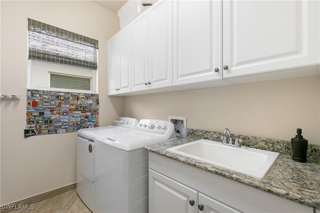 28648 Lobos Cir, Bonita Springs, FL 34135 - laundry room with independent washer and dryer, cabinet space, and baseboards