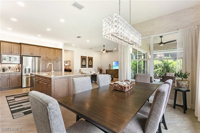 28648 Lobos Cir, Bonita Springs, FL 34135 - dining area with a ceiling fan and recessed lighting