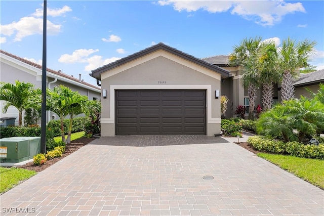 28648 Lobos Cir, Bonita Springs, FL 34135 - single story home featuring stucco siding, decorative driveway, and an attached garage