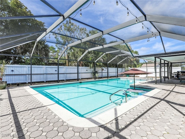 208 Erie Dr, Naples, FL 34110 - view of pool featuring a patio area, a fenced backyard, and glass enclosure
